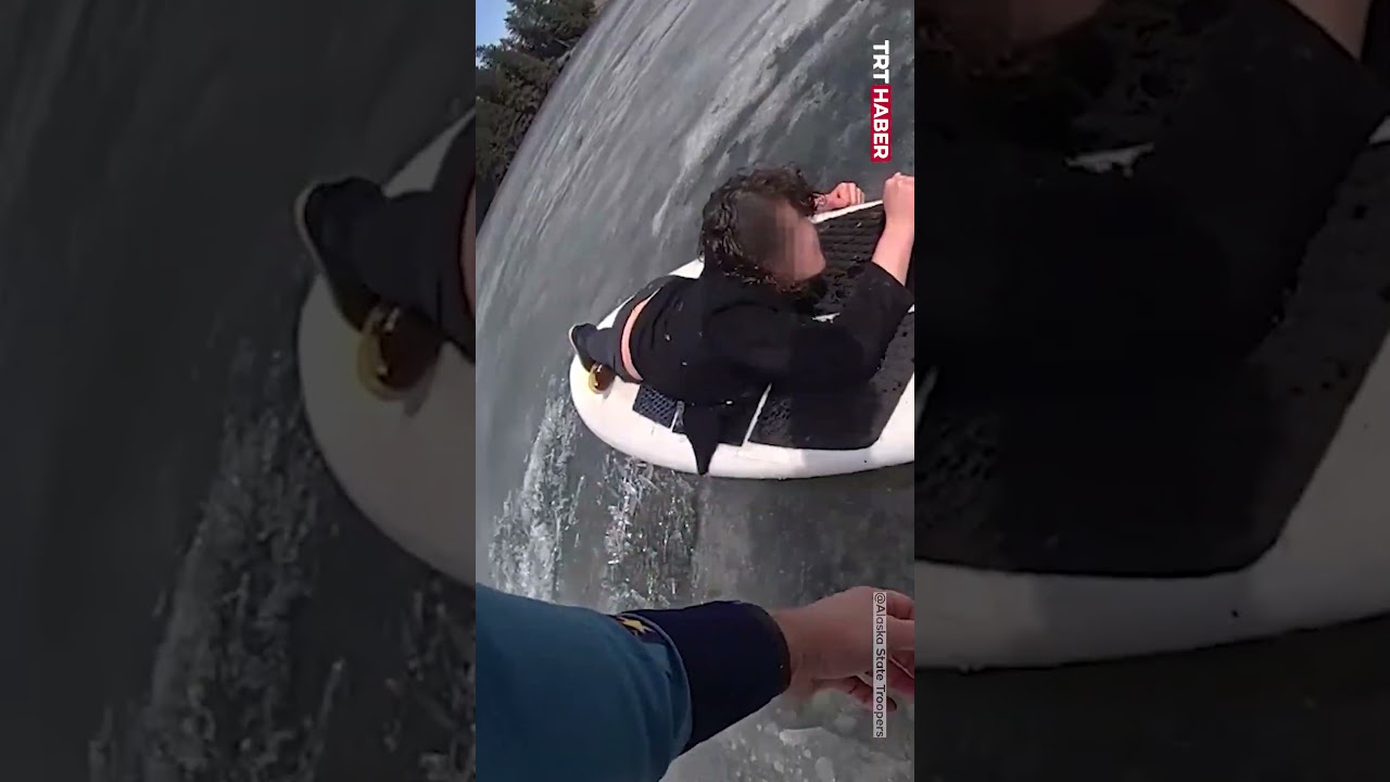 ABD’nin Alaska eyaletindeki bir gölde, buzun kırılması sonucu suya düşen gencin kurtarılma anları…